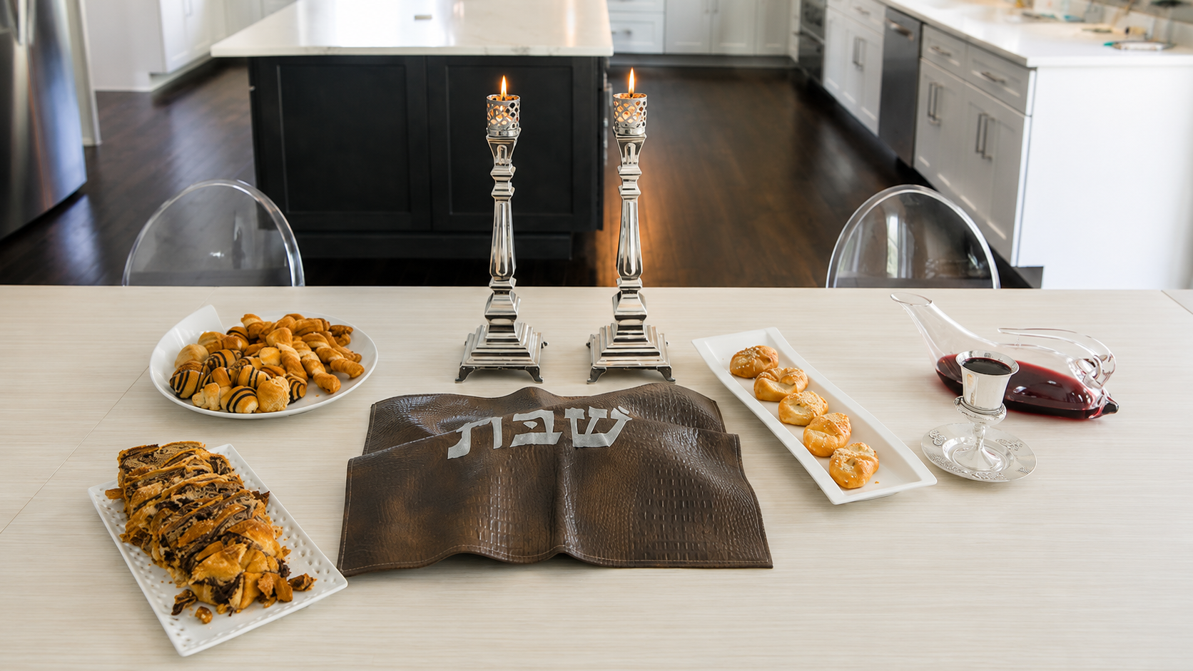 The Shabbat table with grape juice, challah, and a full house.