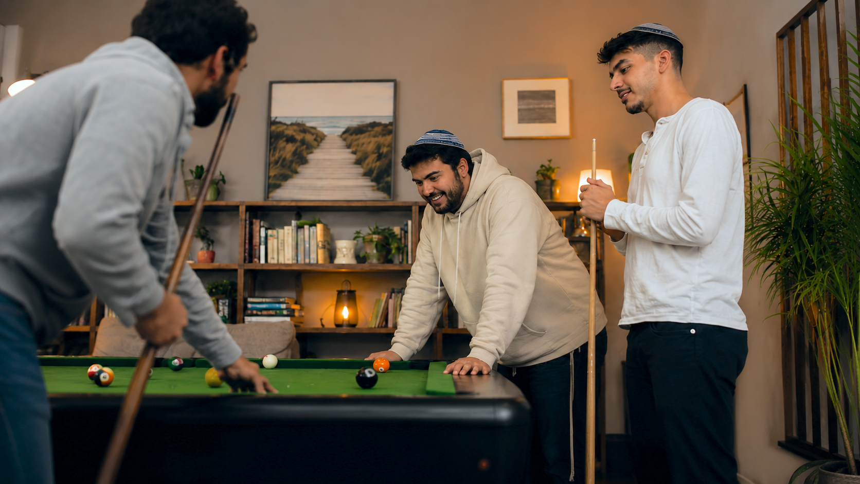 Residents sharing coffee, a game of pool, or a quiet conversation on the couch.