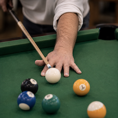 Residents playing a game of pool in the Clubhouse.